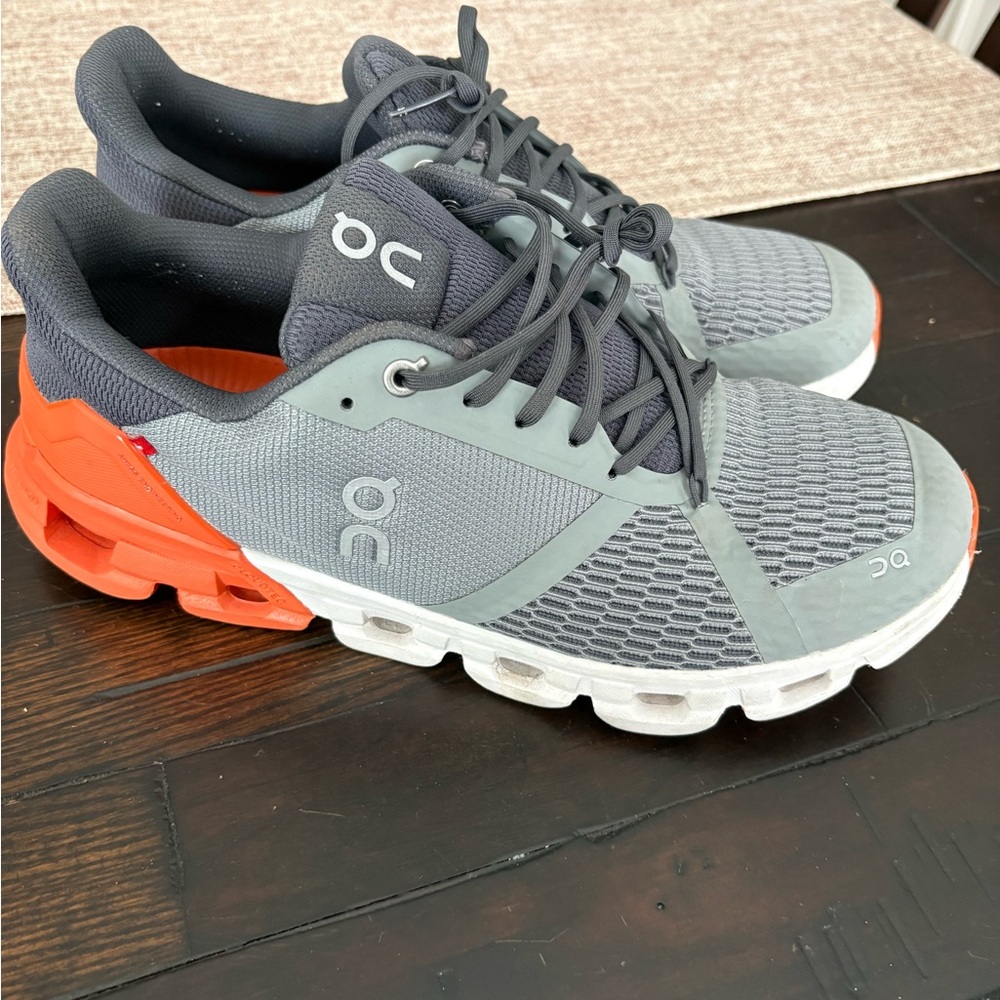 On Running Charcoal and Tangerine Athletic Shoes